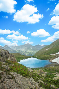 Scenic Mountain Lake in the Caucasus with Clear Blue Water and Majestic Peaks