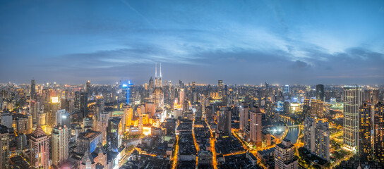 Fototapeta premium Panoramic aerial view of city skyline and commercial buildings at night in Shanghai