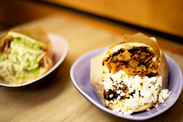 Tasty Arepa Close-up. This version of the Venezuelan dish is called Pabellon Criollo and it is the corn bread with shredded beef, black beans and white cheese