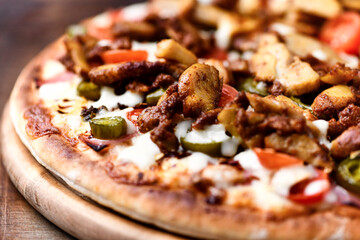 Gyros Pizza with jalapeno pepper and mozzarella cheese. Soft focus. Close up.