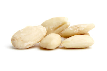 Close-up of a pile of blanched almonds, showcasing their smooth texture and light ivory color. Perfect for healthy eating or food-related themes