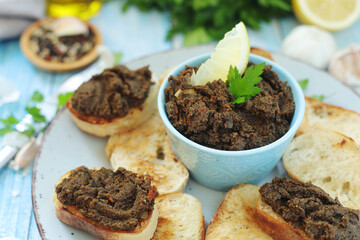 A bowl with tapenade - traditional olive dip in Mediterranean region