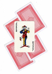 A montage of playing card backs with a joker revealed.