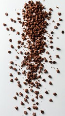 Naklejka premium Cascade of Delicious Chocolate Chips on a Clean White Surface Perfect for Baking and Dessert Themed Projects with a Culinary Focus