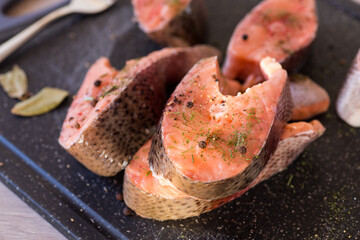 Salmon steaks with herbs and black pepper