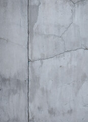 Texture of old gray concrete wall with cracks and scratches which can be used as a background. Cracked Concrete Wall Texture