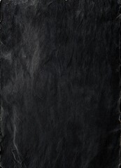 Black paper texture or background. Blank sheet of black paper for design. Dark Paper Texture