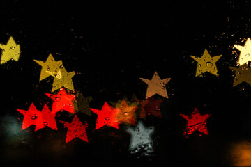Star bokeh traffic lights in the rain