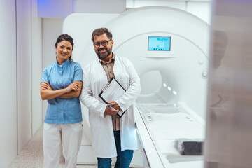 Smiling Medical Professionals Next to an MRI Machine in a Modern Clinic