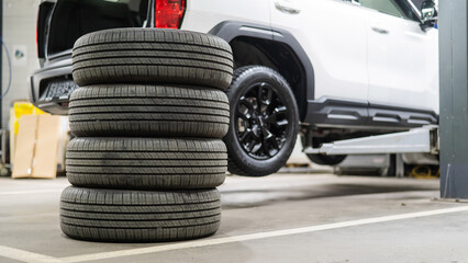 Changing tires for a car according to the season. 