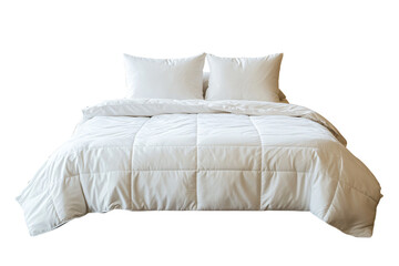 a bed with a white comforter and pillows
