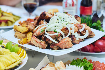 Barbecue on the festive table. Lots of treats