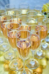 Lots of champagne glasses on the table. Festive reception