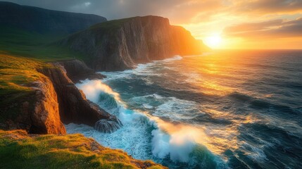 Fototapeta premium Stunning sunset illuminating rugged cliffs and crashing waves along a picturesque coastline overlooking the ocean