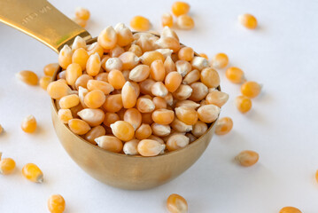 Yellow Popcorn Kernels in a Measuring Cup