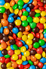 Multicolored dragee, candy background, sweets
