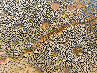 Dry and cracked ground land. Global warming and climate change. Environmental pollution by chemical waste.