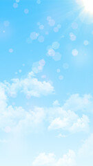 blue sky with clouds and sun rays with shiny bokeh lights ,nature weather spring and summer day time vertical social media background	