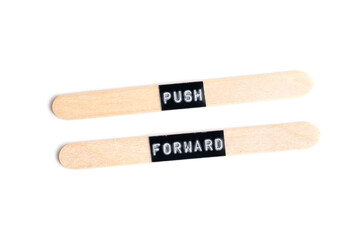 Push forward, words on wooden sticks on white background.