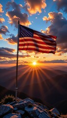 Obraz premium American Flag Waving in the Wind on a Mountain Peak at Sunset, Representing Patriotism, National Pride, and the Spirit of Independence on a Symbolic and Majestic Landscape 