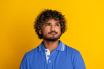 Fototapeta premium Portrait of a Trendy Young Man in Casual Style Against a Bright Yellow Background