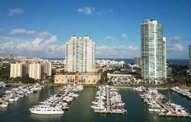 Obraz premium Yachting marina. Luxury yacht charter. Miami port marina. Luxury yachting in summer. Docked yacht in port of Miami. Marina luxury cityscape. Port with yacht. Fishing boats in marina