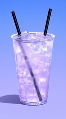 Close up of a tall plastic cup filled with a light purple, ice filled beverage. Two black straws are inserted. The background is a solid light purple.