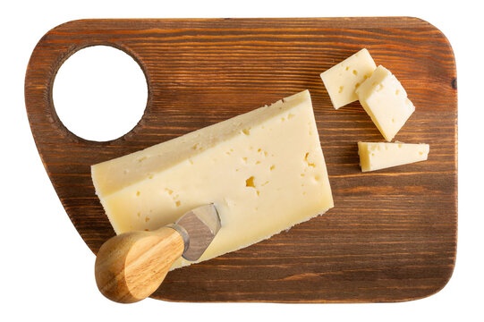 Cheese plate isolated on white background. Italian asiago cheese on wooden board. Top view.
