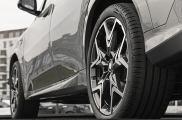 side back rear view Part of modern luxury new car. Wheels and tires wheel tyre tire of luxury vehicle sporty auto with a powerful braking system and discs. automobile perspective © Maxim Chuev