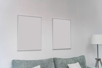 Interior in a light style, templates for two paintings on the wall, photo