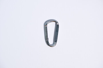 Metal carabiner on a white background.
