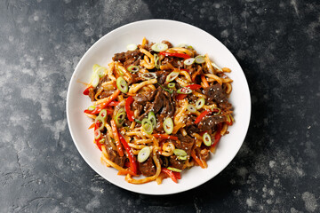 Stir fry udon noodles with beef and vegetable. asian style food