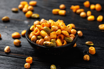 Sweet chilli Crunch protein packed mix of baked corn pieces, edamame beans, chickpeas and corn hoops. Healthy snack concept