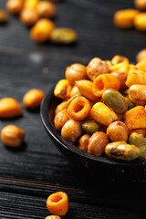 Sweet chilli Crunch protein packed mix of baked corn pieces, edamame beans, chickpeas and corn hoops. Healthy snack concept