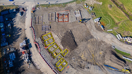 Aerial view of housing foundations being built on a building site and housing estate