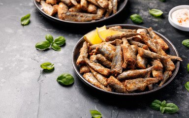 Crispy fried sardines with herbs and lemon. Healthy mediterranean food