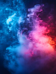 Obraz premium Colorful smoke swirling in dark studio