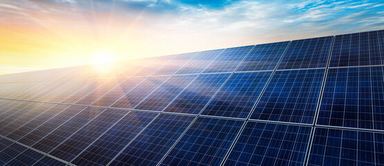Solar panels at bright sunrise with light rays and blue sky - 3D illustration