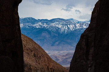 Fototapeta premium Snow capped mountains seen from a canyon, in eastern California.