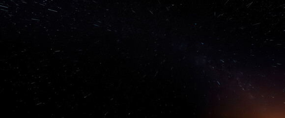 Fototapeta premium mesmerizing canvas of celestial wonder where distant stars paint streaks across night sky in timeless beauty