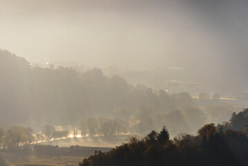 top view of the Adda river during an autumnal morning, Lecco province, Italy