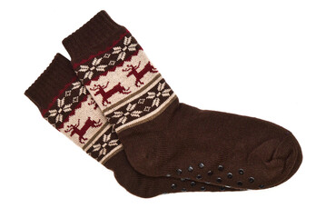Warm winter comfort socks with reindeer and snowflake patterns and rubber treads on the soles