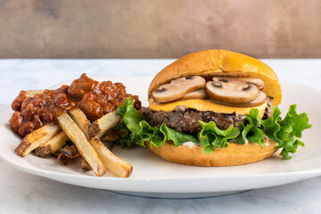 cheese burger top with mushrooms  served with chilli fries