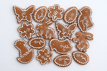 Romantic decorated Easter gingerbread cookies of various shapes, white background