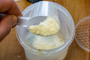 protein and carbohydrate cocktail preparation using a shaker. Dietary activity. healthy lifestyle, healthcare nutrition concept. protein powder.