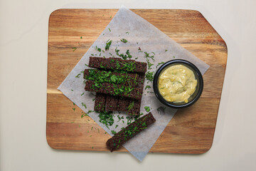 a simple yet delicious snack or appetizer, featuring the hearty texture and flavor of rye bread,...