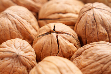 Whole cracked walnuts. Raw unprocessed nuts with protein, fiber and healthy fats. Macro shot