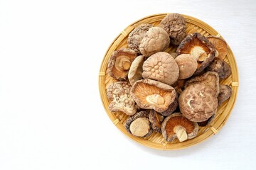 Dried mushrooms in basket  , Deied shiitake mushrooms on white background