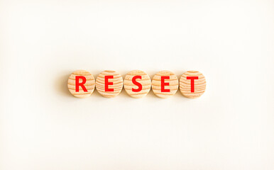 Reset symbol. Concept word Reset on beautiful wooden circles. Beautiful white table white...