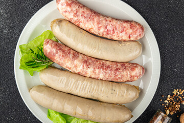 raw sausages pork, beef, chicken, lamb fresh tasty food dish delicious gourmet food background on the table rustic food top view copy space